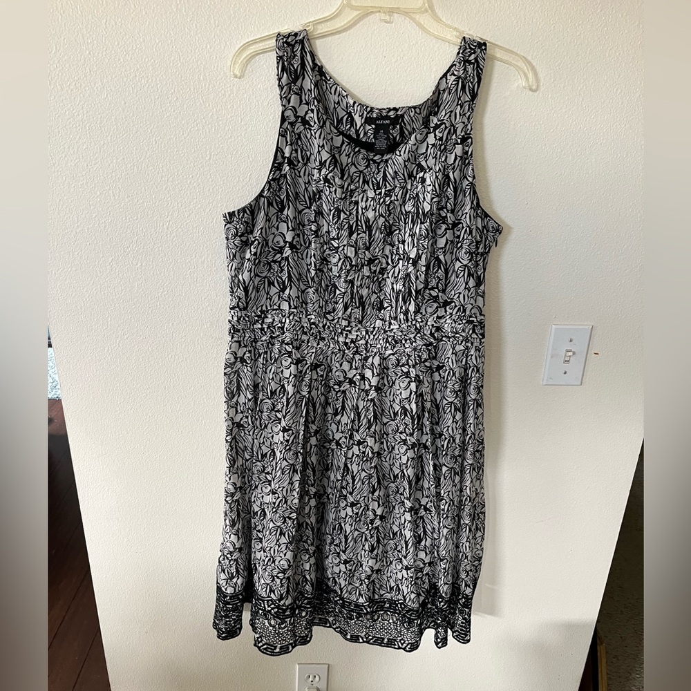Black and white dress by Alfani. Black lining and beautiful lace trim. Size 14